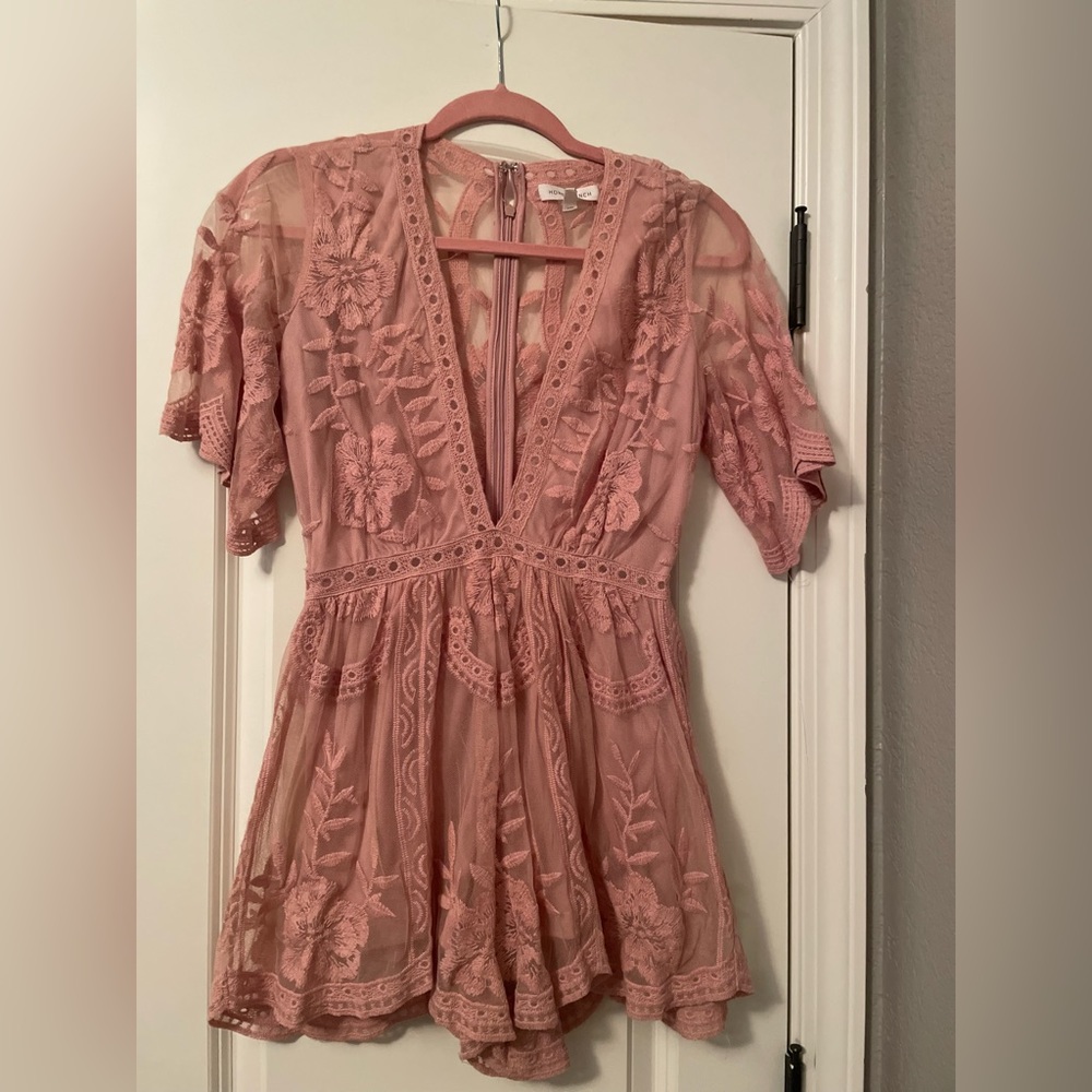 Blush colored lace romper, deep V neck